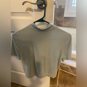 Babaton T-shirt side medium